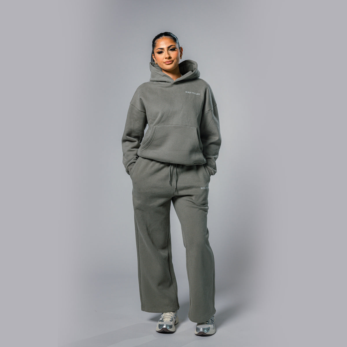 Front view of women's olive relaxed fit tracksuit set by Built To Last.