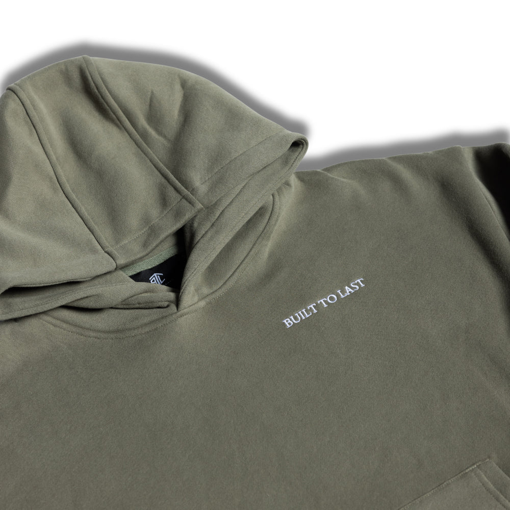 Close-up detail of hood and logo on women's olive relaxed fit hoodie by Built To Last.