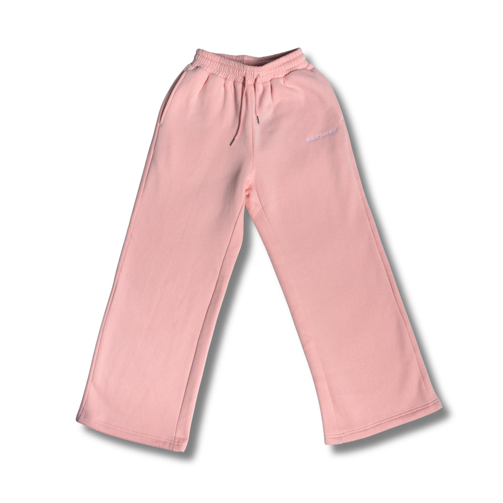 Flat lay full view of women's pink relaxed fit sweatpants by Built To Last.