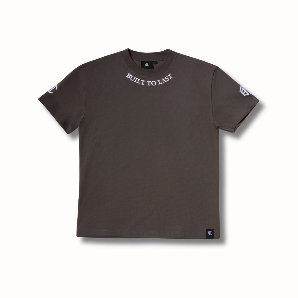 Front view of Built to Last Legacy Tee Stone heavyweight cotton T-shirt with embroidered neckline logo and minimalist design