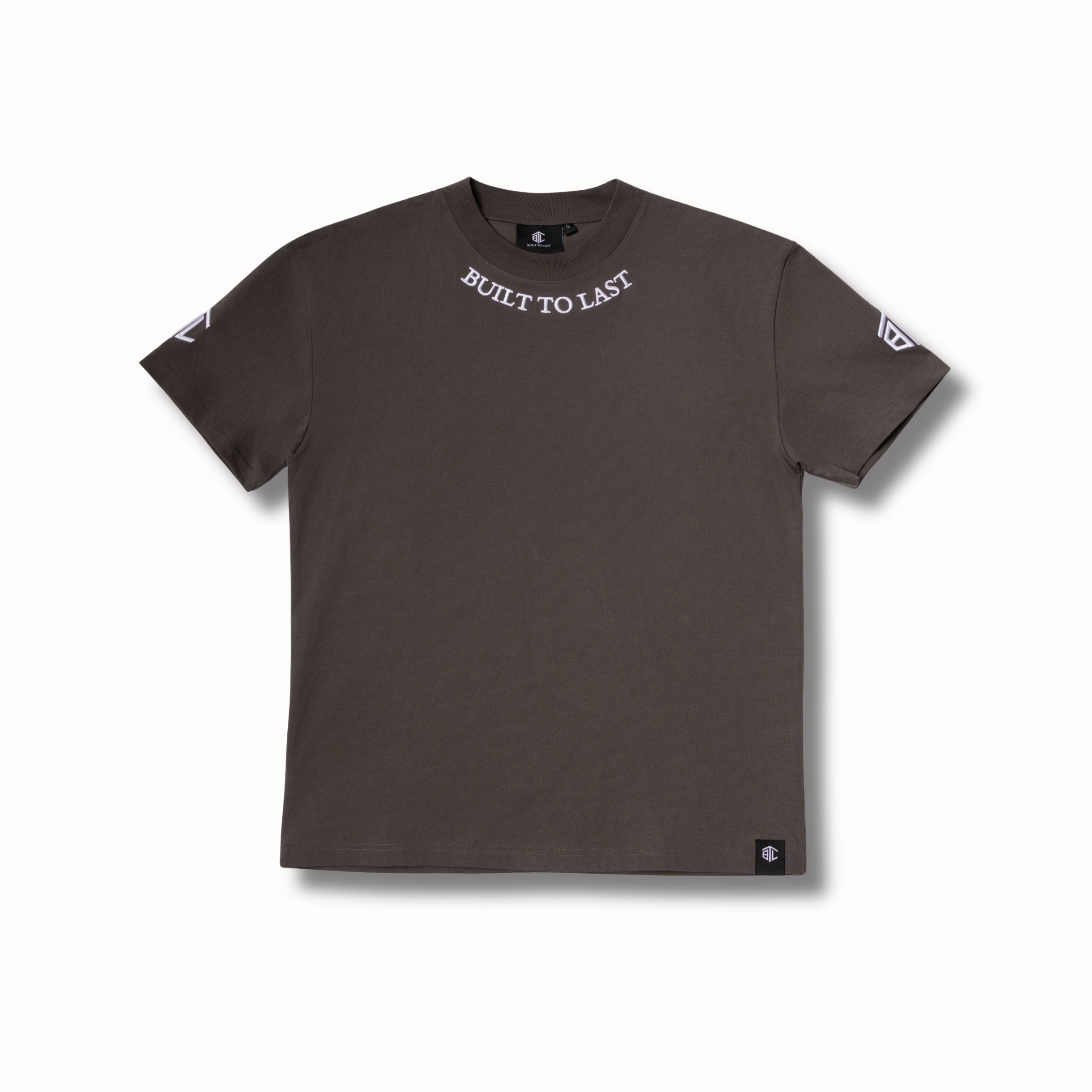 Front view of Built to Last Legacy Tee Stone heavyweight cotton T-shirt with embroidered neckline logo and minimalist design