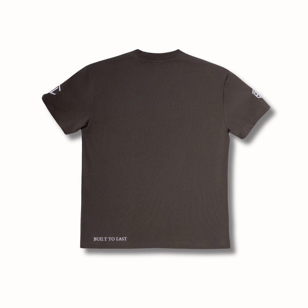 Back view of Built to Last Legacy Tee Stone heavyweight cotton T-shirt with minimalist design and signature hem branding