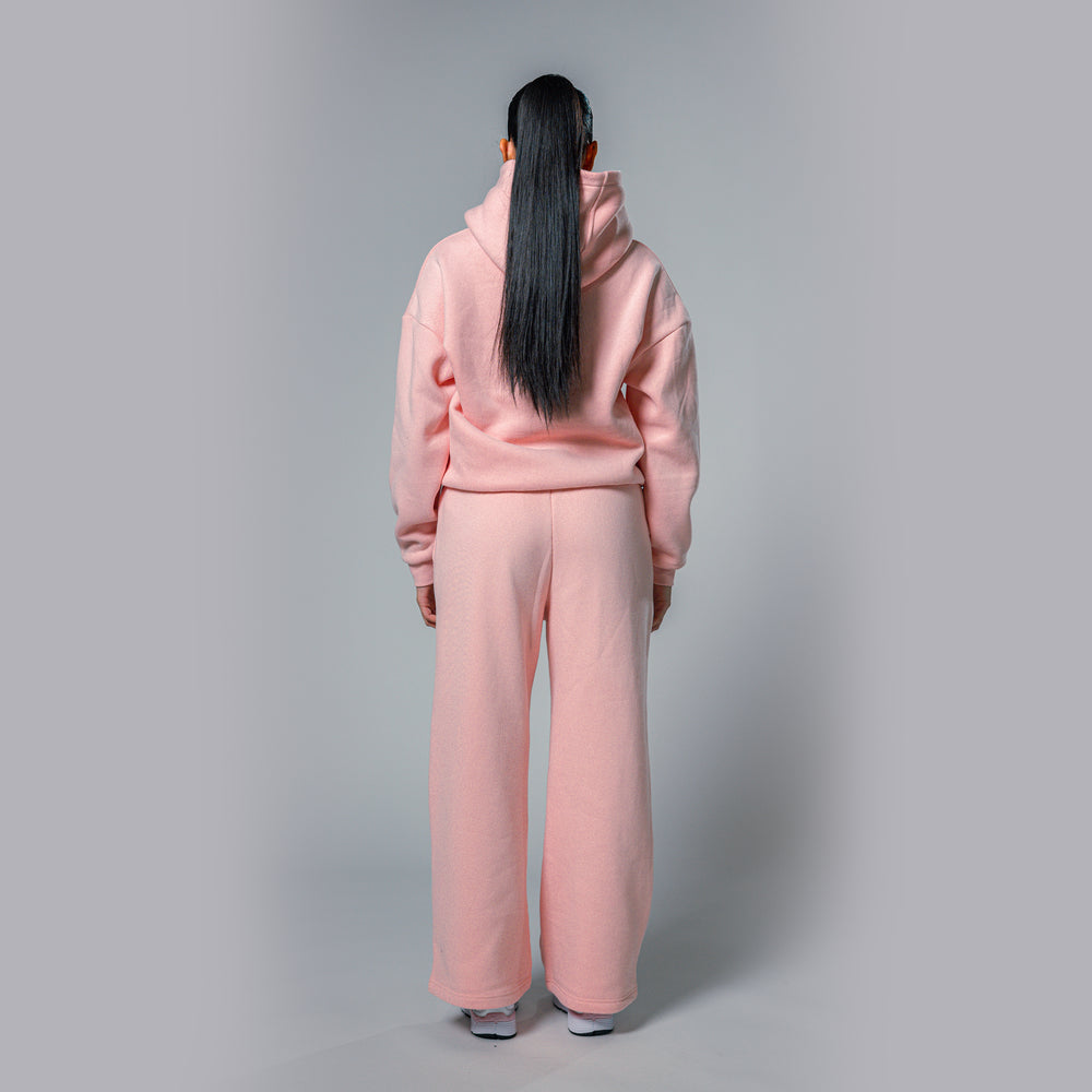 Back view of women's light pink relaxed fit tracksuit set by Built To Last.