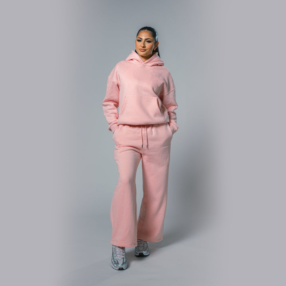 Front view of women's light pink relaxed fit tracksuit set by Built To Last.