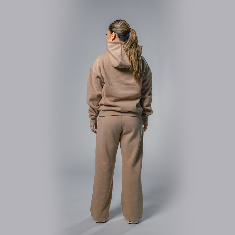 Back view of women's beige relaxed fit tracksuit set by Built To Last.