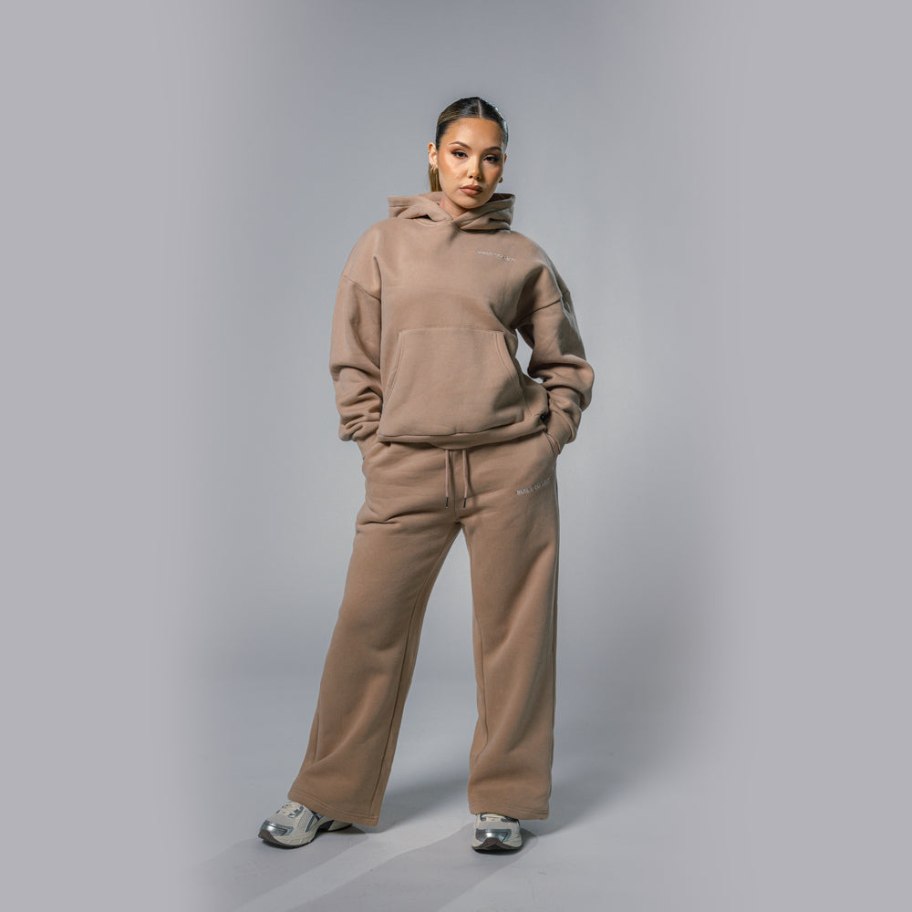 Front view of women's beige relaxed fit tracksuit set by Built To Last.