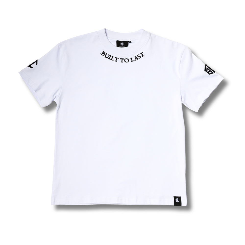 Front view of a white Built To Last Clothing t-shirt featuring branded collar text, sleeve logo patches, and a bottom hem label.