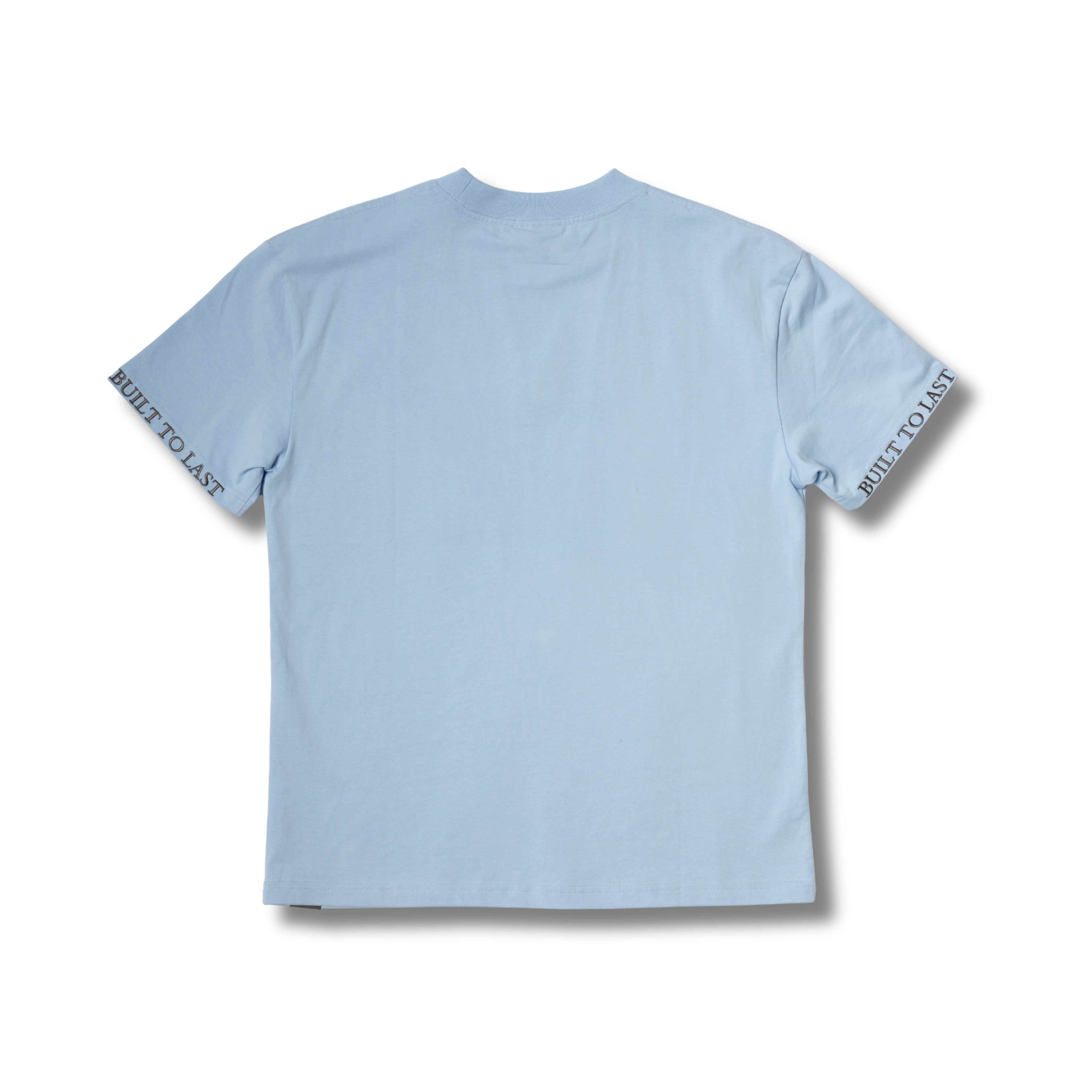 Back view of Built to Last Monolith Tee Blue heavyweight cotton T-shirt with minimalist design and branded sleeve print