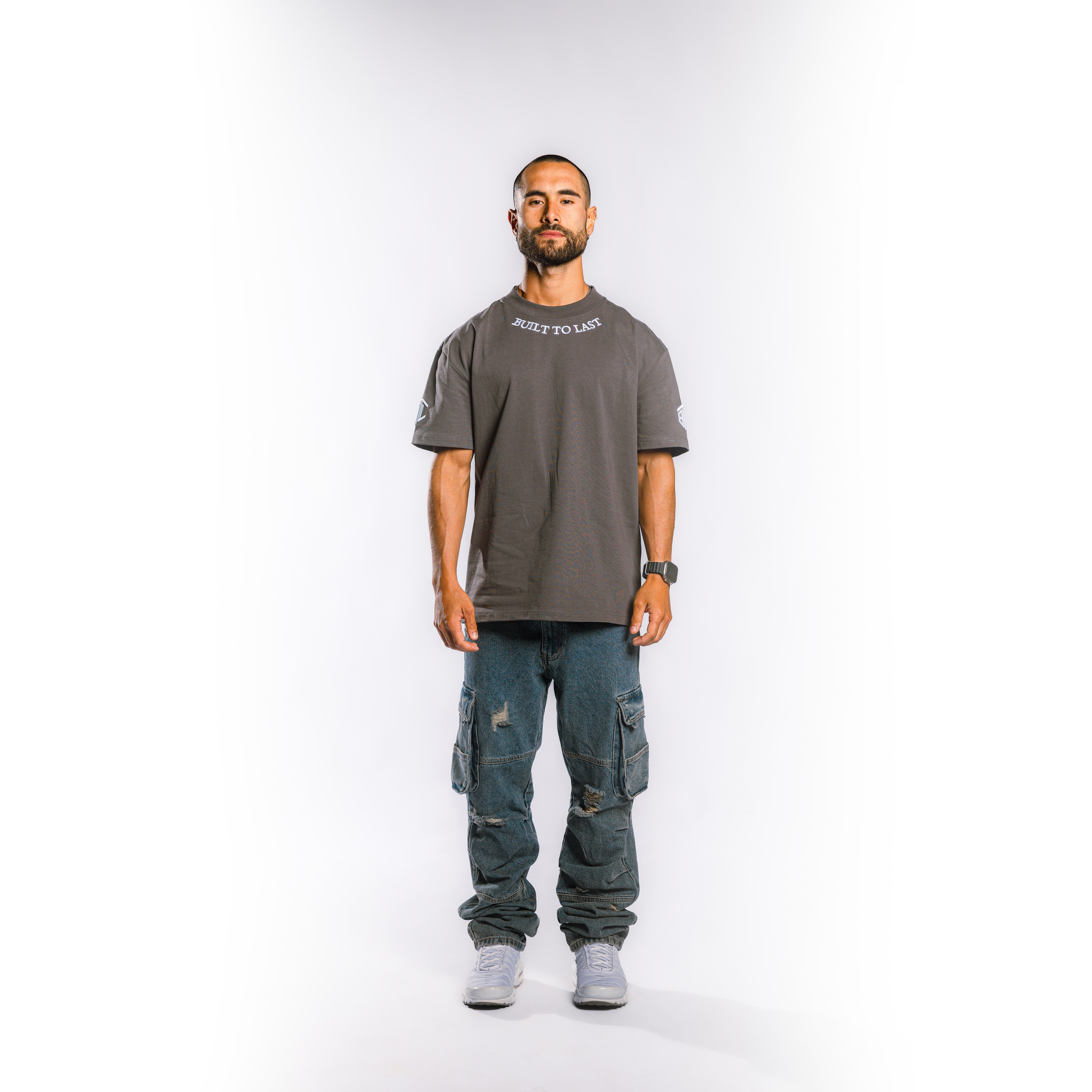 Front view of model wearing Built to Last Legacy Tee Stone heavyweight cotton T-shirt with relaxed oversized fit