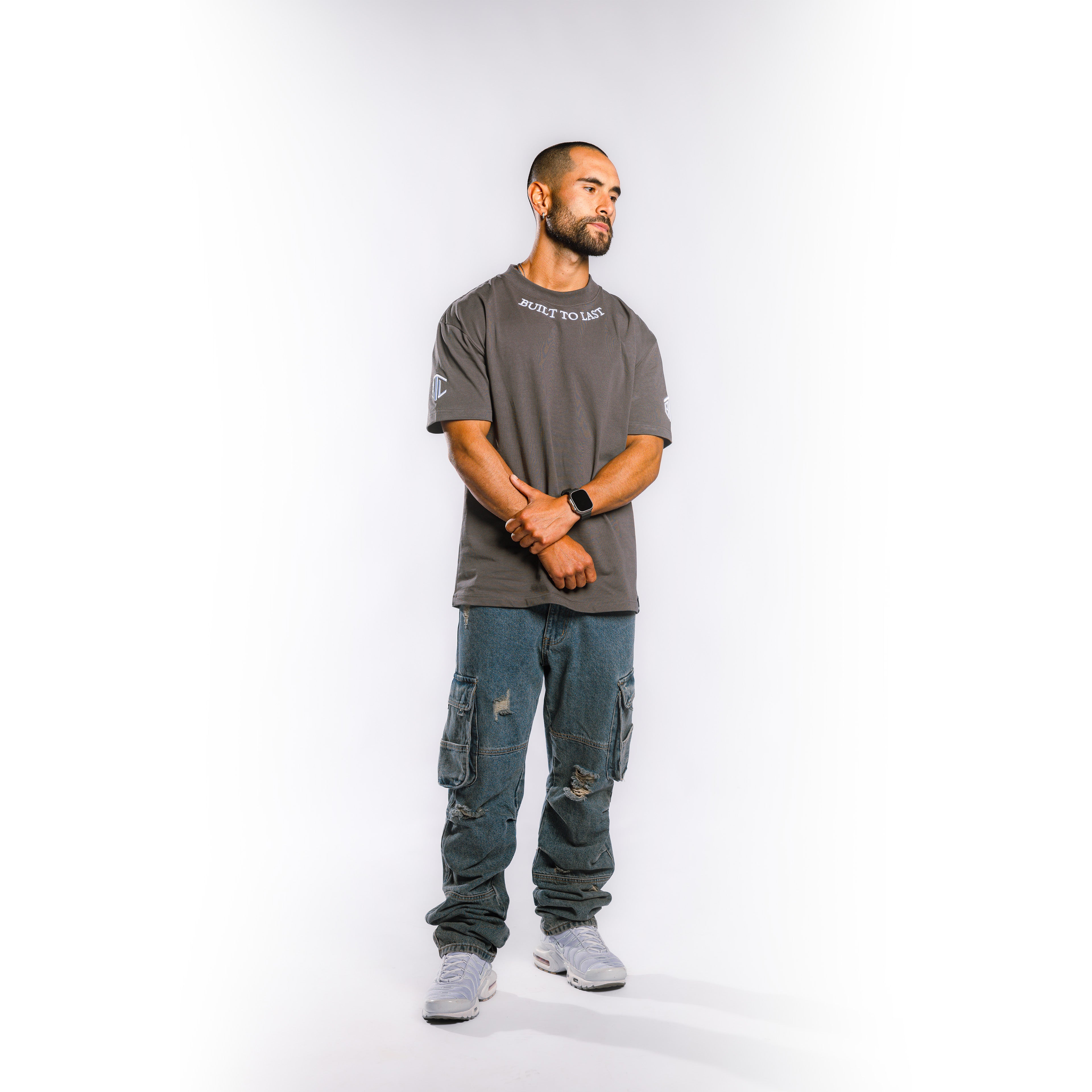 Model wearing Built to Last Legacy Tee Stone heavyweight cotton T-shirt in relaxed everyday streetwear style