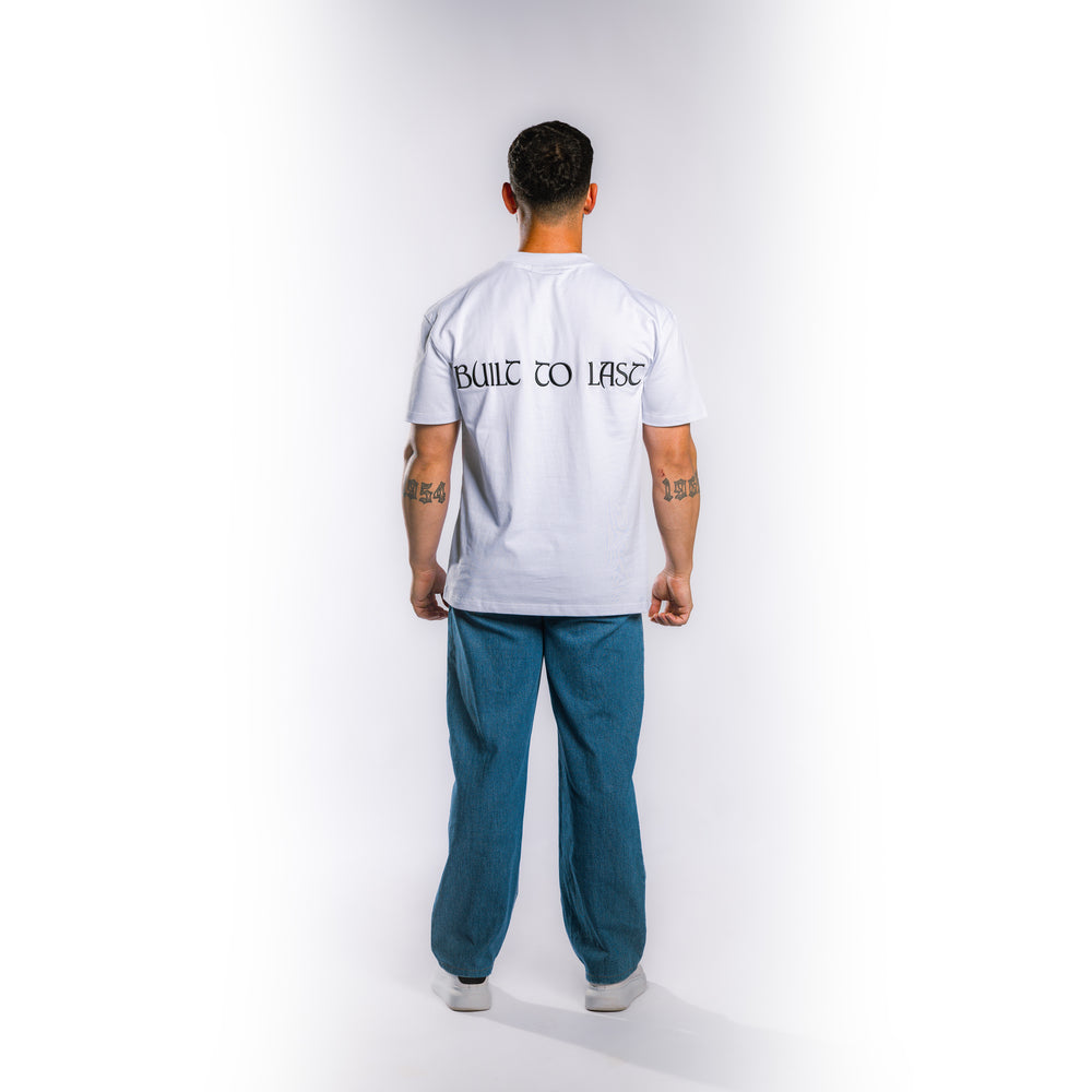 Back view of model wearing Built to Last Eternal Tee White heavyweight cotton T-shirt with embroidered Built To Last at the back