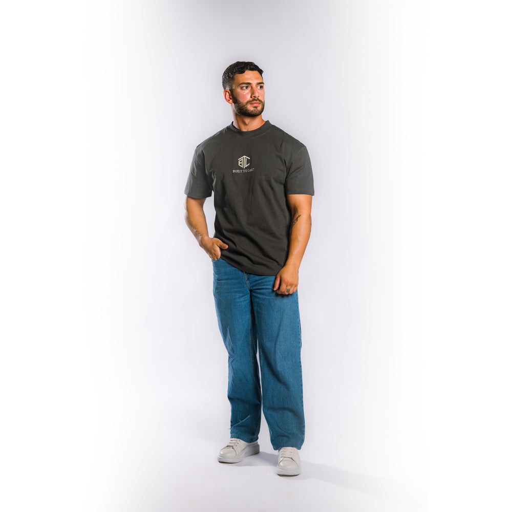 Model wearing Built to Last Eternal Tee Granite heavyweight cotton T-shirt with embroidered chest logo