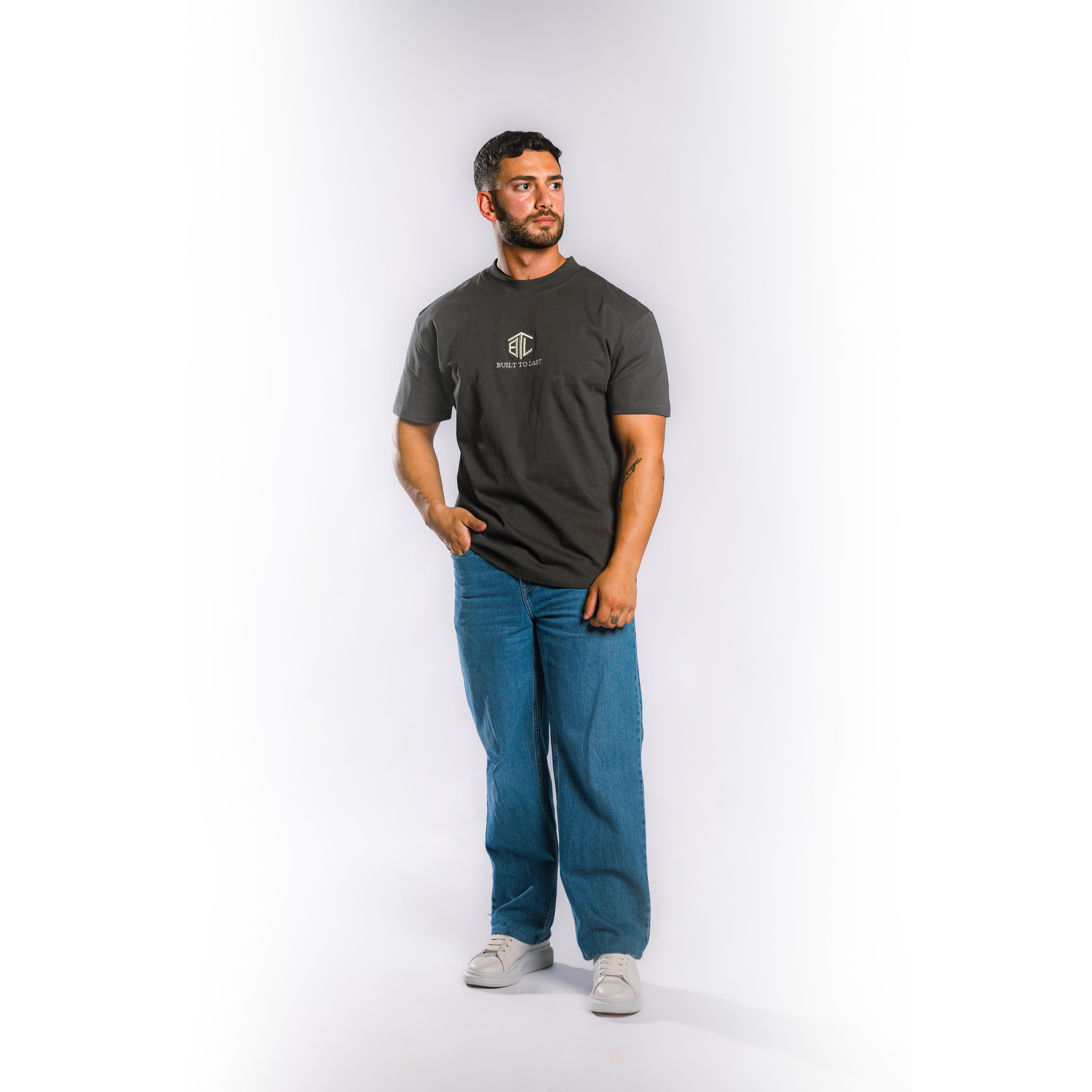 Model wearing Built to Last Eternal Tee Granite heavyweight cotton T-shirt with embroidered chest logo