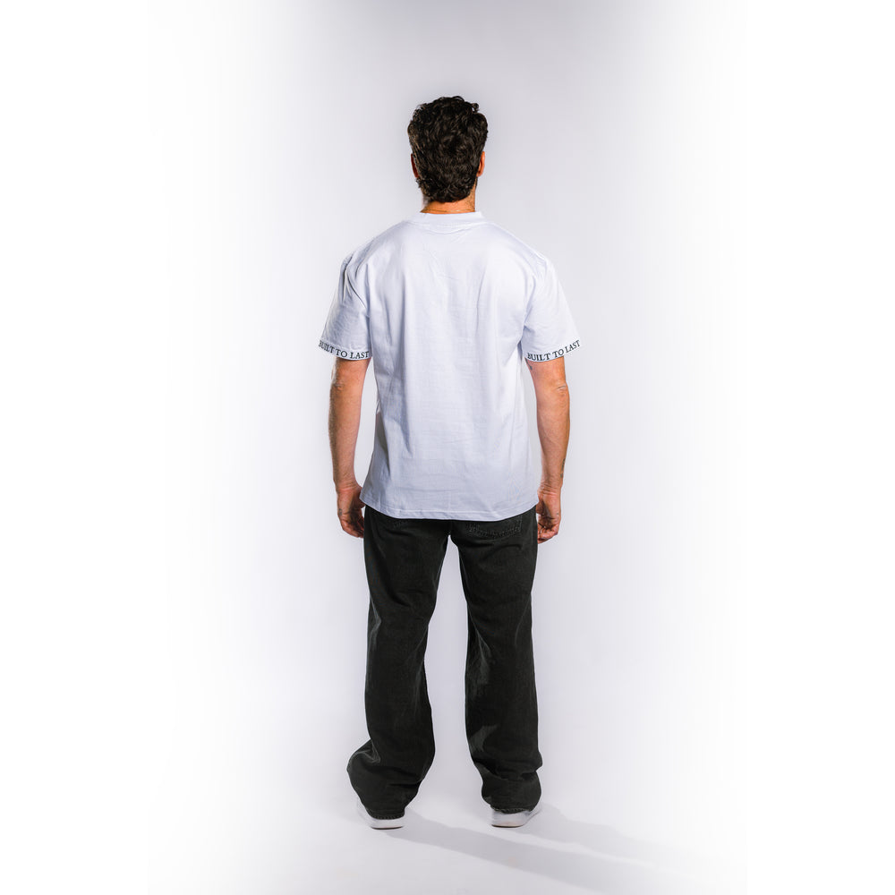 Back view of model wearing Built to Last Monolith Tee White heavyweight cotton T-shirt with minimalist oversized fit